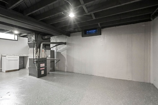 below grade area featuring heating unit