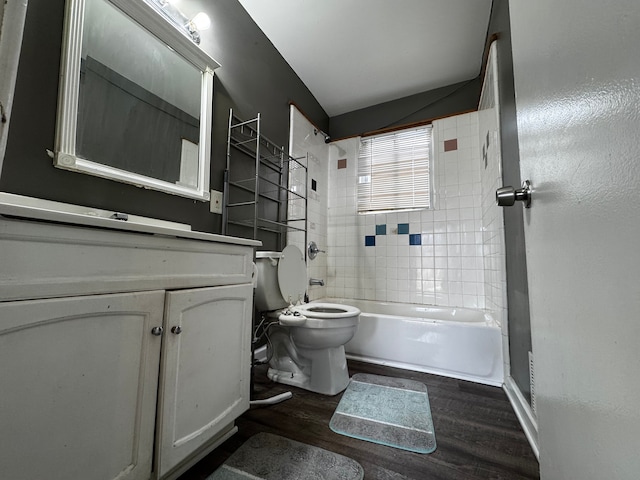bathroom featuring vanity, shower / bathing tub combination, wood finished floors, and toilet