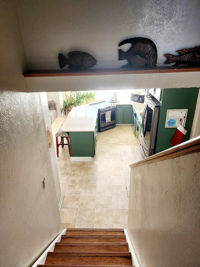 stairs with a textured ceiling