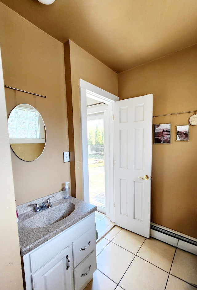 bathroom featuring tile patterned flooring, vanity, and a baseboard radiator