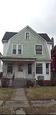 back of house featuring covered porch