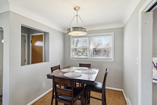 dining room featuring baseboards