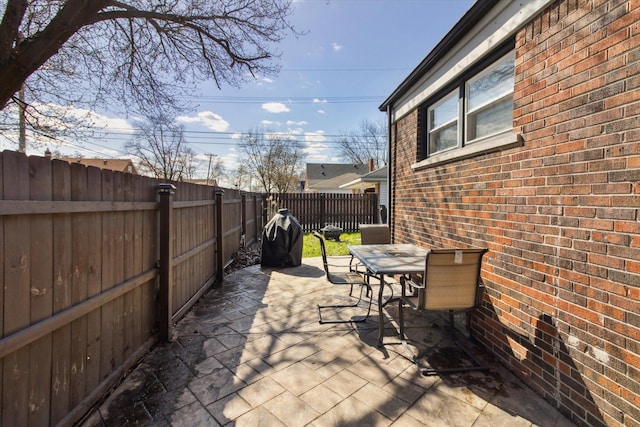 view of patio / terrace with a fenced backyard and outdoor dining area