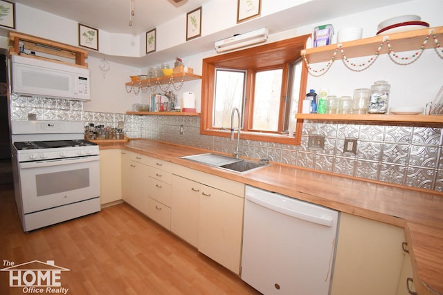 kitchen with open shelves, a sink, wooden counters, white appliances, and decorative backsplash