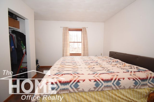 bedroom featuring wood finished floors