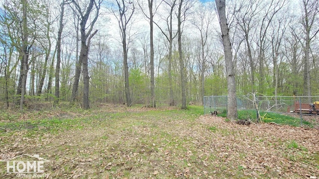 4405 E M-71 Rd, Corunna, MI 48817 - view of yard featuring fence and a wooded view