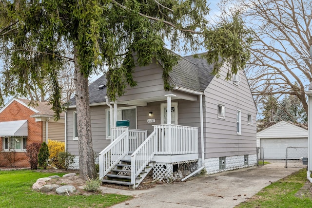 23737 Couzens Ave, Hazel Park, MI 48030 - bungalow-style home with an outdoor structure, roof with shingles, and a detached garage