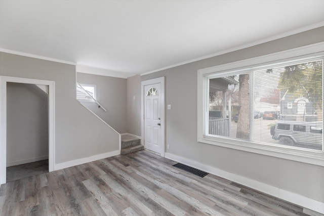 23737 Couzens Ave, Hazel Park, MI 48030 - foyer featuring stairway, wood finished floors, visible vents, and ornamental molding