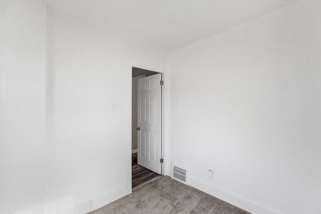 23737 Couzens Ave, Hazel Park, MI 48030 - spare room featuring carpet floors, visible vents, and baseboards