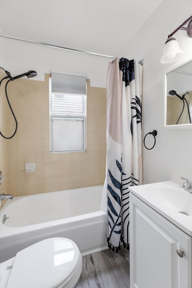 23737 Couzens Ave, Hazel Park, MI 48030 - bathroom with toilet, vanity, wood finished floors, and shower / bath combo with shower curtain