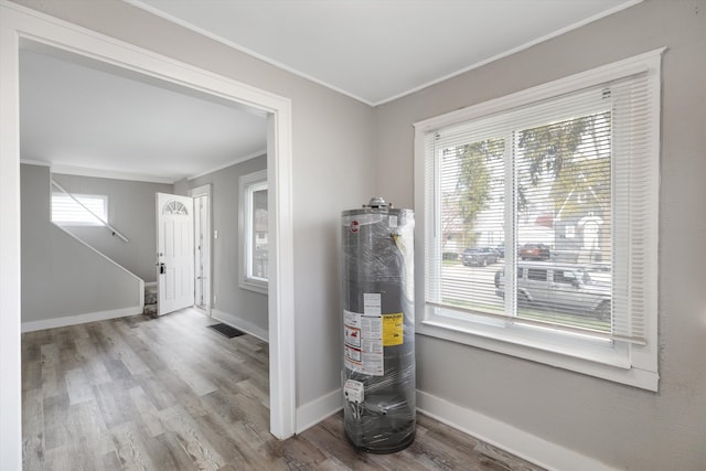 23737 Couzens Ave, Hazel Park, MI 48030 - entryway with wood finished floors, a healthy amount of sunlight, gas water heater, and crown molding