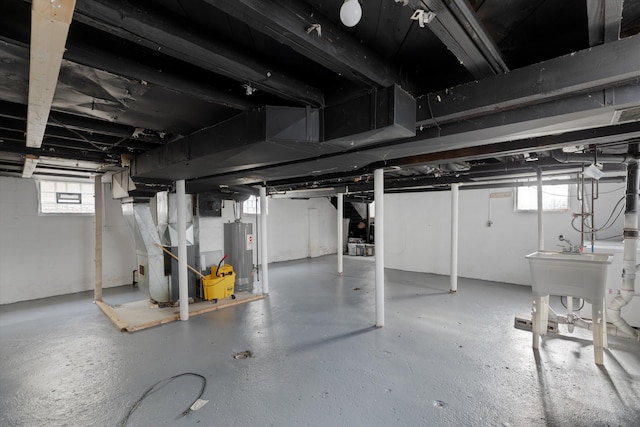 23737 Couzens Ave, Hazel Park, MI 48030 - basement featuring heating unit, water heater, and a sink