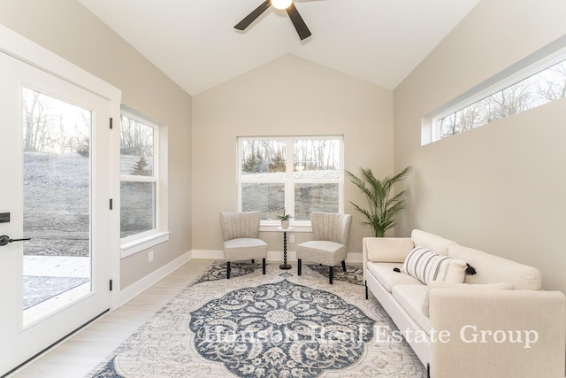 sitting room with ceiling fan, baseboards, wood finished floors, and lofted ceiling