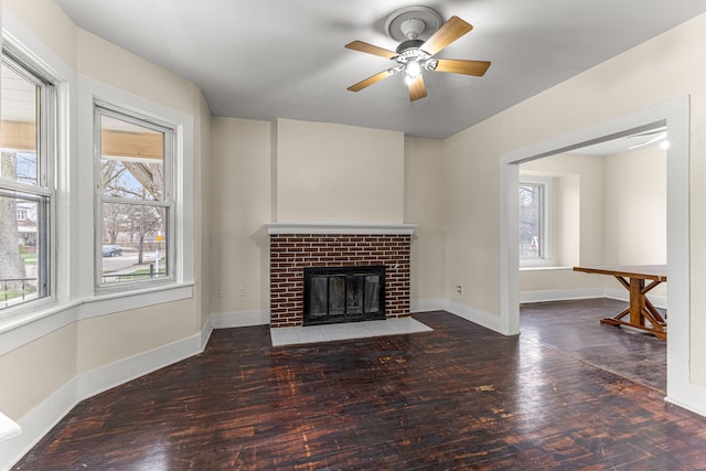 1409 Charter St, Lincoln Park, MI 48146 - unfurnished living room with baseboards, ceiling fan, a brick fireplace, and plenty of natural light