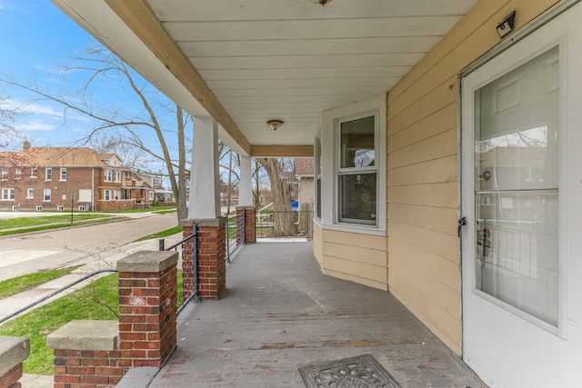 1409 Charter St, Lincoln Park, MI 48146 - view of patio featuring a porch and a residential view