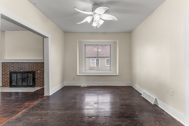 1409 Charter St, Lincoln Park, MI 48146 - unfurnished living room with a ceiling fan, visible vents, a brick fireplace, baseboards, and hardwood / wood-style flooring
