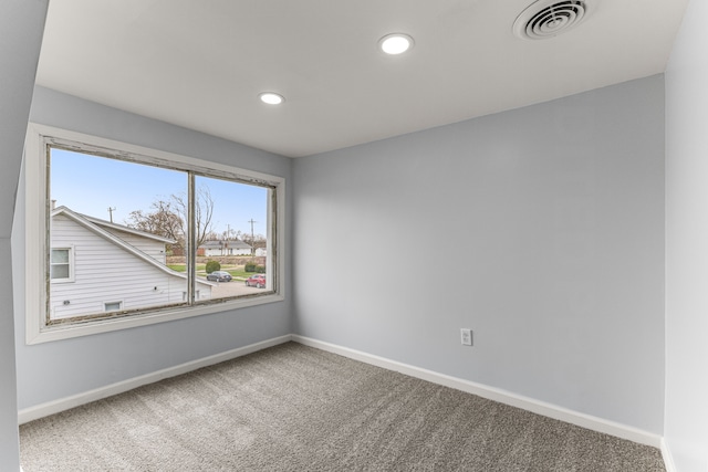 1409 Charter St, Lincoln Park, MI 48146 - carpeted empty room with recessed lighting, visible vents, and baseboards