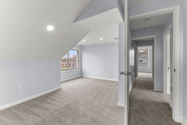 1409 Charter St, Lincoln Park, MI 48146 - additional living space featuring baseboards, carpet, and vaulted ceiling