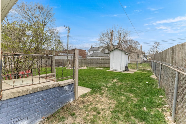 1409 Charter St, Lincoln Park, MI 48146 - view of yard featuring a fenced backyard, a storage shed, and an outdoor structure