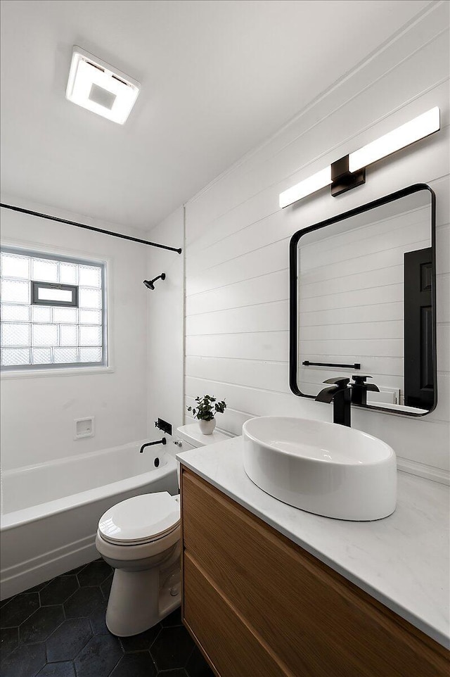 full bath featuring shower / bathtub combination, toilet, tile patterned flooring, and vanity