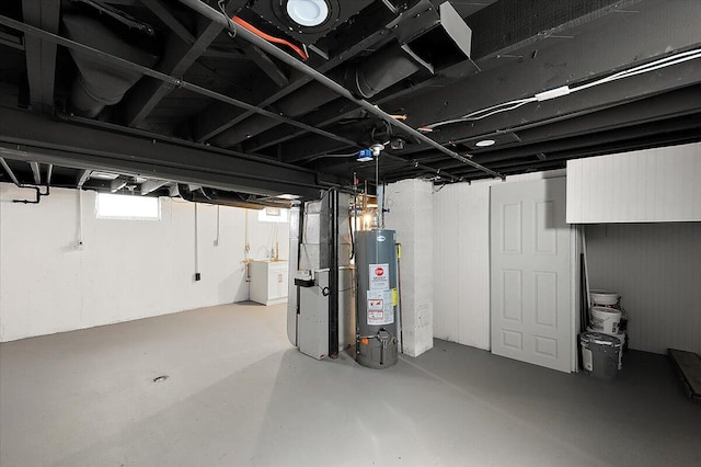 basement with water heater and heating unit