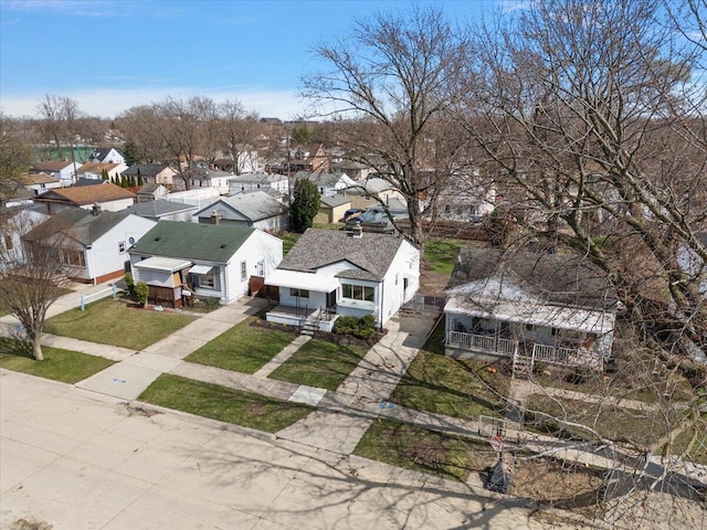 birds eye view of property with a residential view