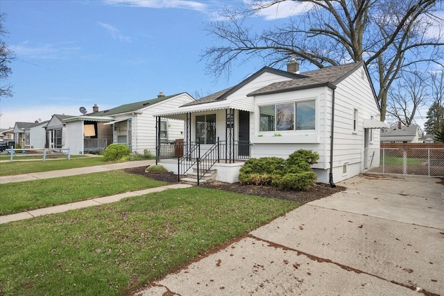 bungalow featuring crawl space, fence, a front lawn, and a gate