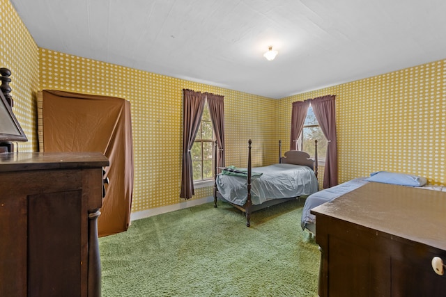 bedroom featuring light colored carpet and wallpapered walls