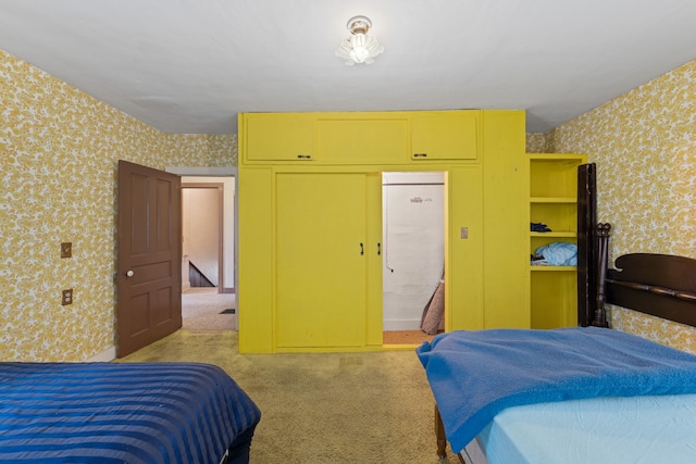 bedroom featuring wallpapered walls and carpet floors