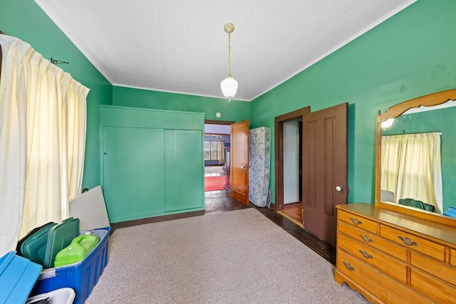 bedroom featuring wood finished floors and ornamental molding