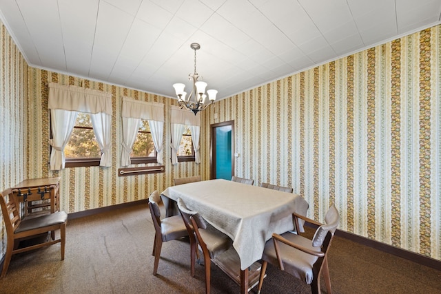 carpeted dining room with wallpapered walls, baseboards, an inviting chandelier, and ornamental molding