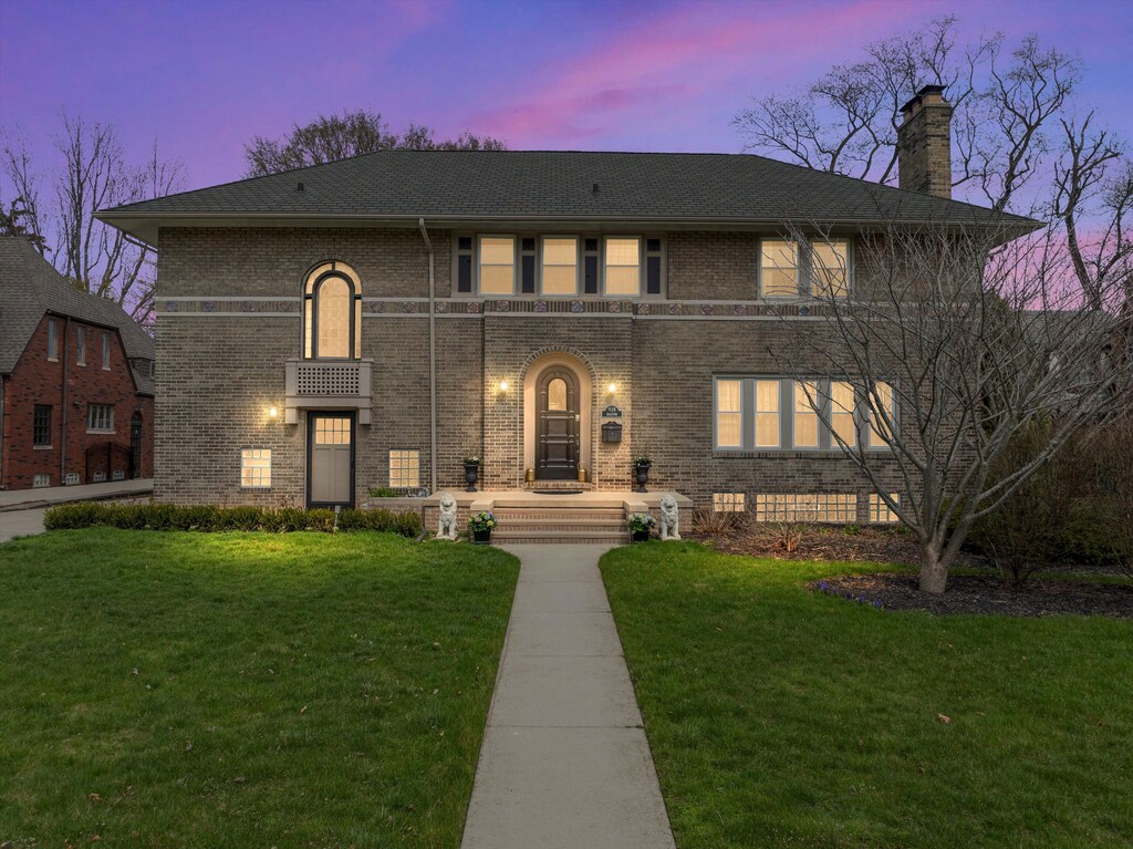 938 Balfour St, Grosse Pointe Park, MI 48230 - view of front facade featuring brick siding, a front lawn, and a chimney
