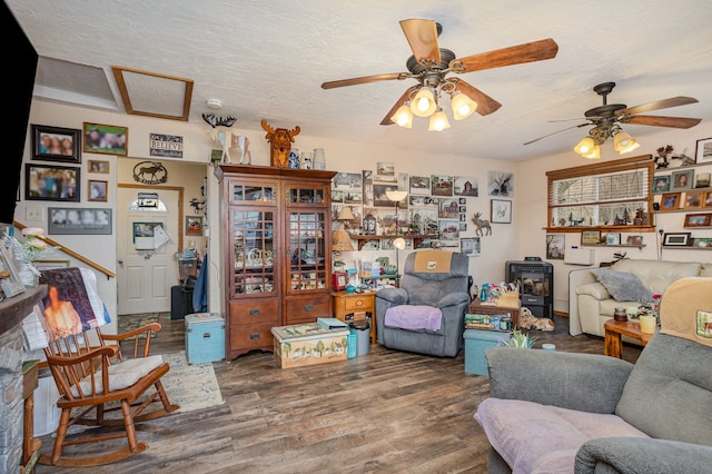 10975 Dorwood Rd, Burt, MI 48417 - living room featuring a textured ceiling, a ceiling fan, and wood finished floors