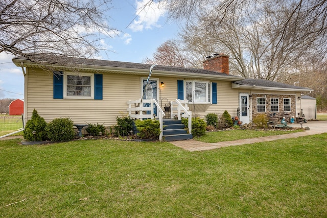 10975 Dorwood Rd, Burt, MI 48417 - ranch-style home with a chimney and a front lawn