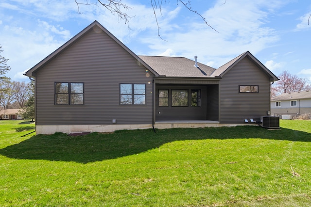 back of house featuring a patio, central air condition unit, and a lawn