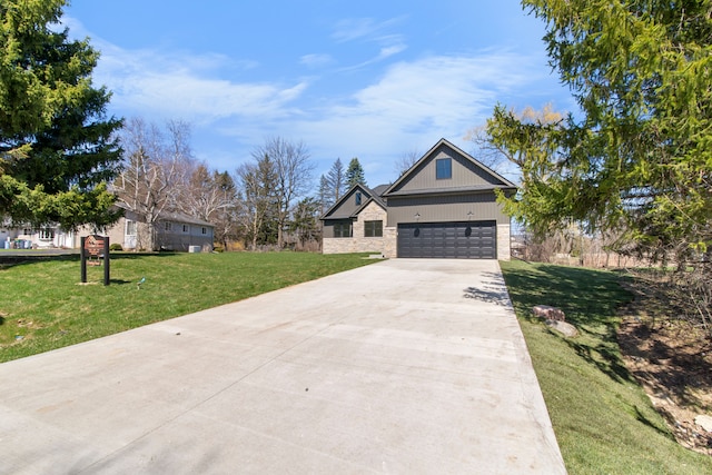 view of front of home with driveway, a front yard, and a garage