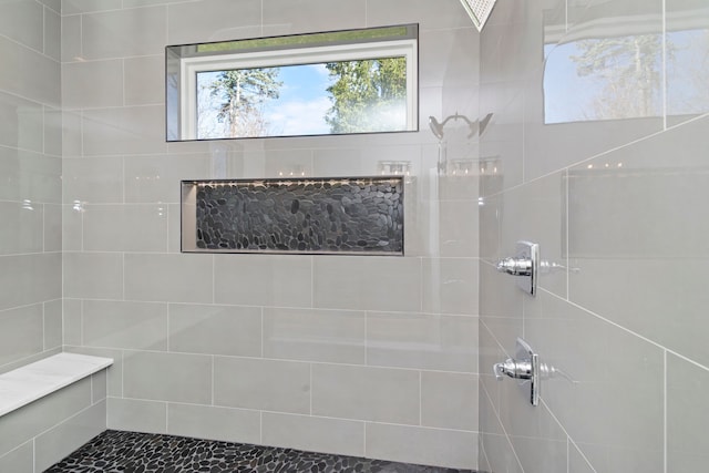 full bath featuring a tile shower