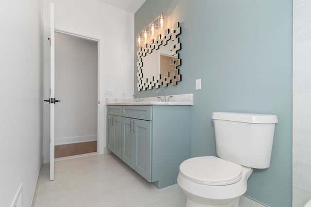bathroom with toilet and vanity