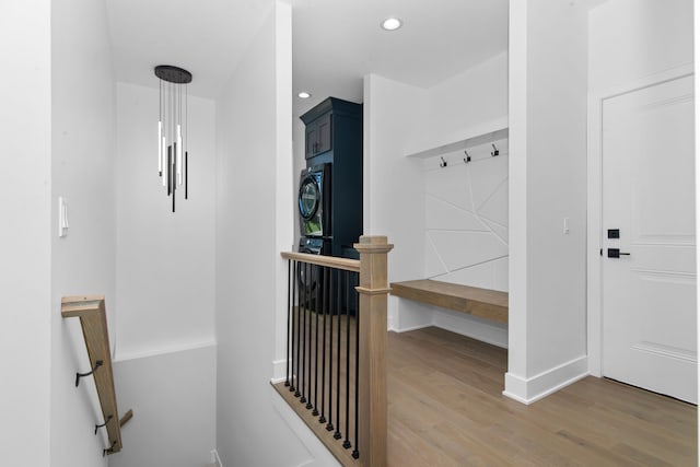 mudroom with light wood finished floors, baseboards, and recessed lighting