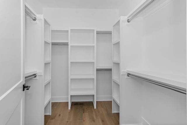 spacious closet featuring light wood-type flooring