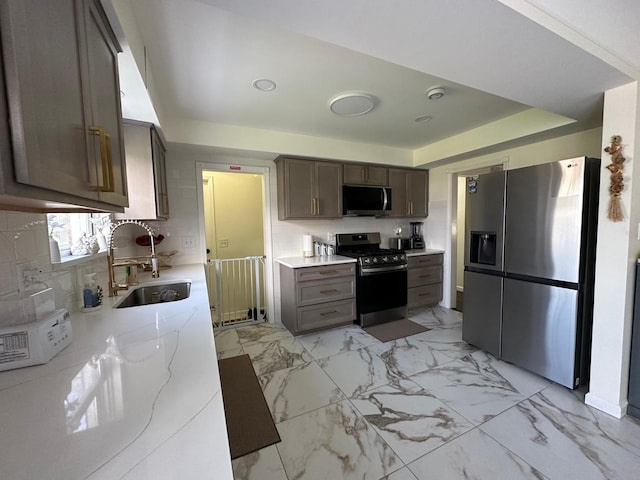 31042 Wellston Dr, Warren, MI 48093 - kitchen with tasteful backsplash, light stone counters, stainless steel appliances, marble finish floor, and a sink