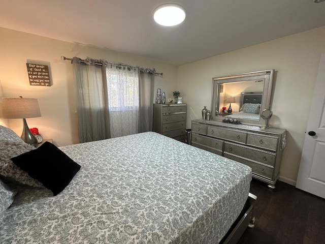 31042 Wellston Dr, Warren, MI 48093 - bedroom featuring dark wood-style flooring and baseboards