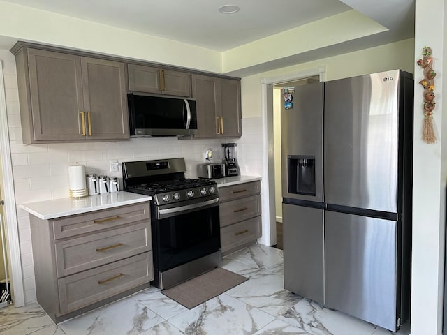31042 Wellston Dr, Warren, MI 48093 - kitchen with tasteful backsplash, light countertops, appliances with stainless steel finishes, and marble finish floor