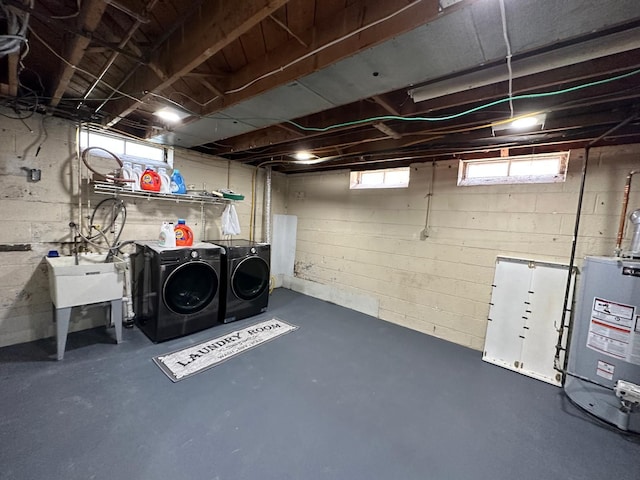 31042 Wellston Dr, Warren, MI 48093 - below grade area featuring water heater and independent washer and dryer