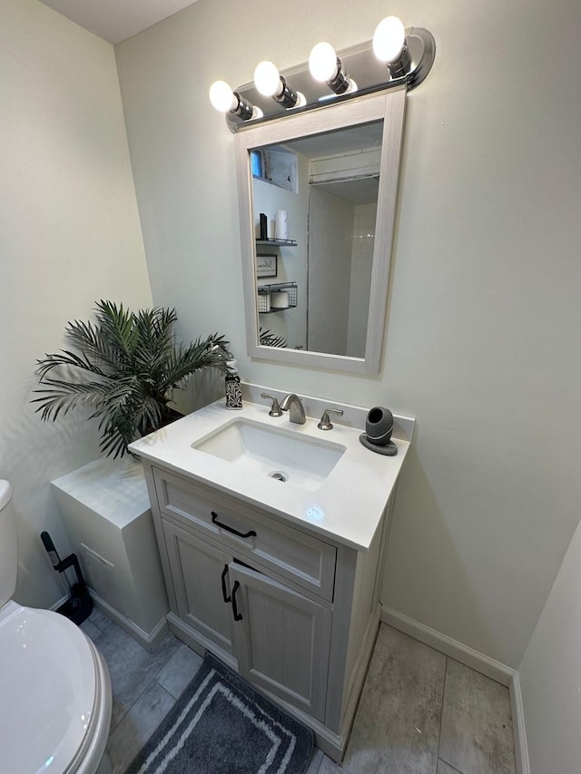 31042 Wellston Dr, Warren, MI 48093 - bathroom with toilet, vanity, and baseboards
