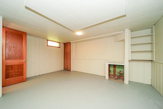 below grade area with a decorative wall