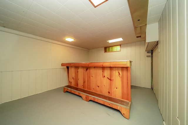finished basement featuring a bar