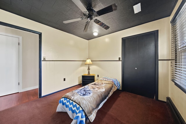 bedroom featuring baseboards, a ceiling fan, and carpet floors