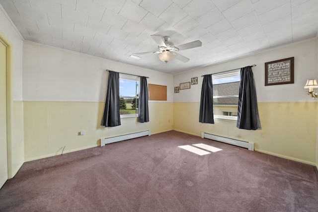 carpeted empty room with a baseboard radiator, a healthy amount of sunlight, and ceiling fan