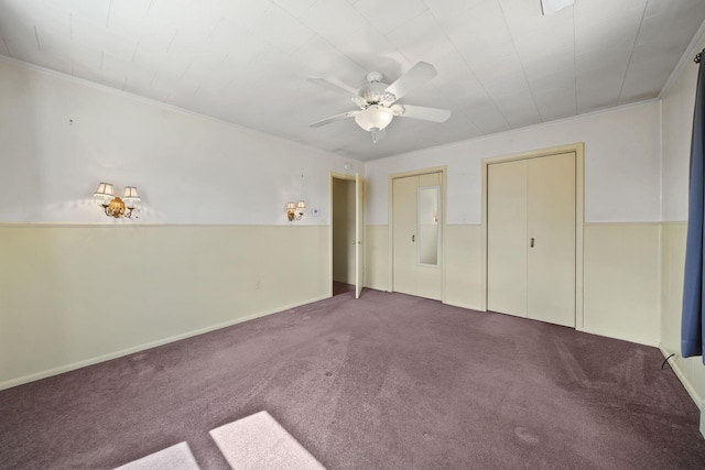 unfurnished bedroom featuring crown molding, a ceiling fan, and carpet
